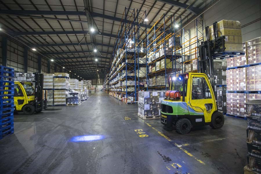Malcolm Group warehouse operations with forklifts and pallet racking